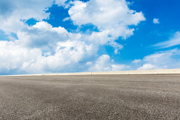 Empty of asphalt road in front of the blue sky