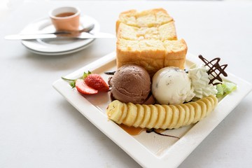 honey toast with whipped cream,ice cream and mix berry
