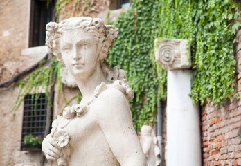 White stone statues and sculptures in the external courtyard of the olimpic theater in Vicenza