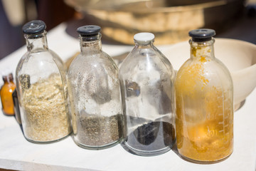 four flasks with some medicine in the street market