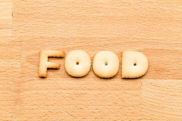 Word food cookie over the wooden background