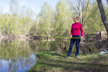 Woman fishing on the fishing rod