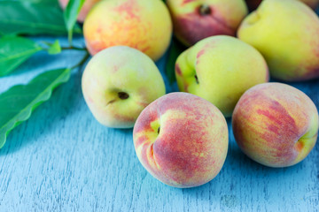 group of fresh peaches on wood background
