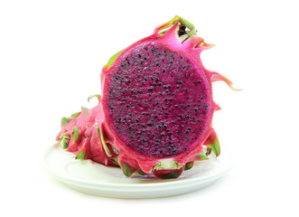 Red dragon fruit in dish on white background