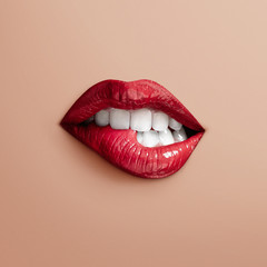 bites separate lips on a beige background - 85978168