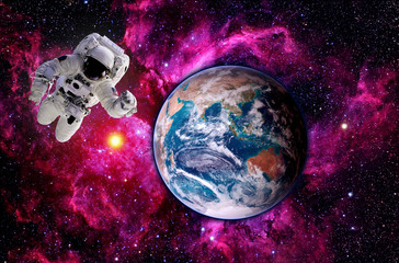 Astronaut spaceman Earth globe world planet outer space. Elements of this image furnished by NASA.