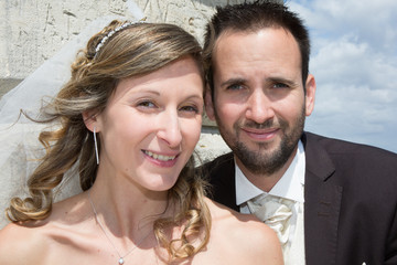 Lovely couple on the beach in wedding dress