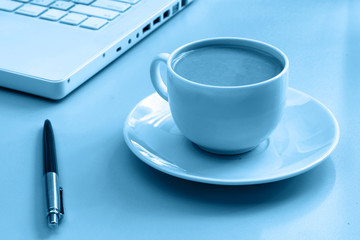 Cup of coffee near press 