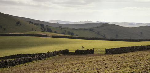 Beautiful bright landscape image of Peak District on sunny Sprin