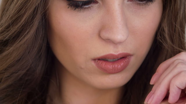 Vertical dolly shot of beautiful girls breast and face