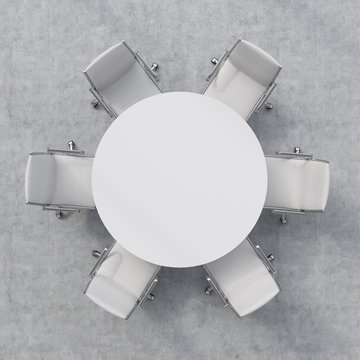 Top View Of A Conference Room. A White Round Table And Six Chairs Around. 3D Interior.