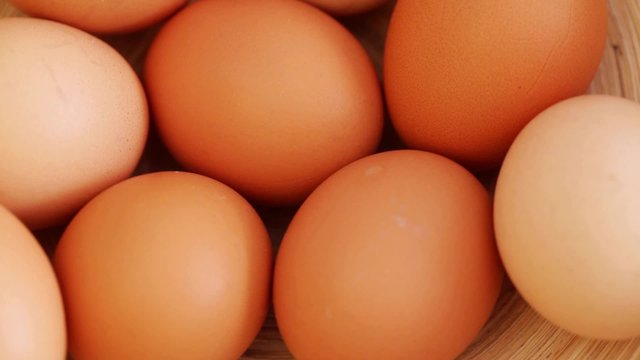 HD 1080 static close up: hen eggs at rotating display