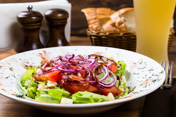 meat salad with spices and vegetables with light beer