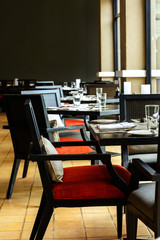interior of restaurant with black wooden table and chair