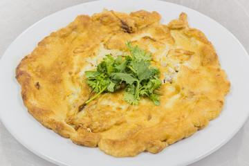 Omelette with vegetables in a meal
