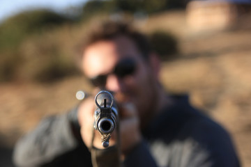 Man aiming with a rifle