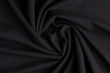 Obraz premium Spiral folds on black cloth