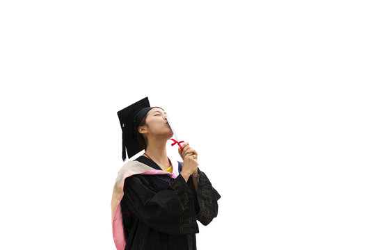 Beautiful female graduate wearing a graduation gown in white background