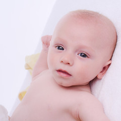 isolated portrait of young happy smiling baby on a white background