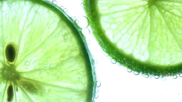 Sparkling water with a slice of lime 
