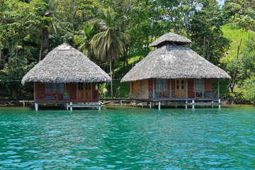 Tropical wooden bungalows over the water