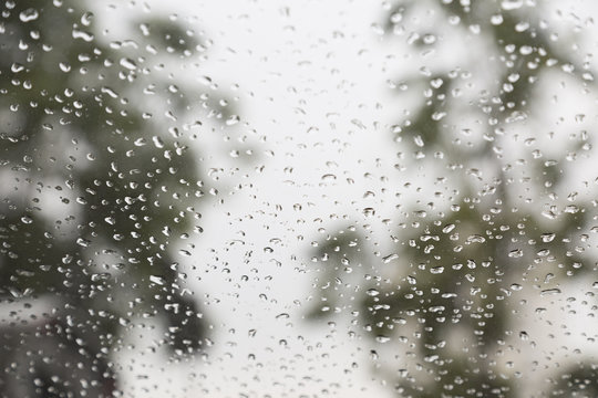 Rain drops on window with a background