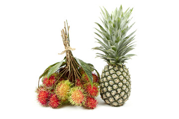 Pineapple and rambutan  isolated on white background.