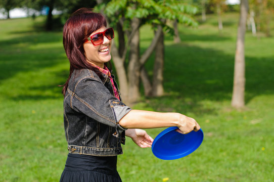Young woman with frisbee