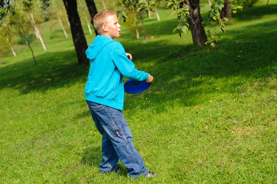 Little boy playing frisbee