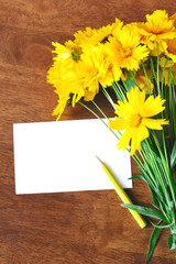 yellow flowers and card for congratulations