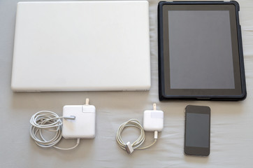 set of modern devices - laptop, tablet ,charger and phone