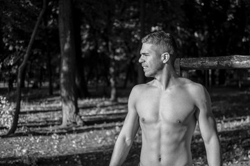 Man photographed in street workout session. Photo was taken in early morning, around 6am in city park Dudova forest. Black and white photo.