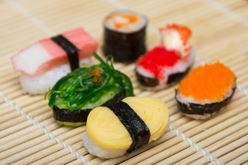 delicious sushi on bamboo mat
