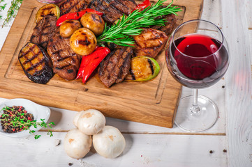 Grilled pieces of meat and different vegetables
