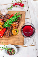 Grilled pieces of meat and different vegetables