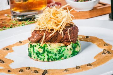 Fried meat with whiskey sauce