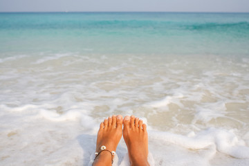 Woman's Bare Feet on the beach.