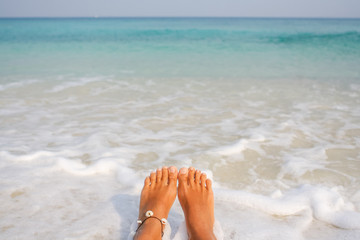 Fototapeta na wymiar Woman's Bare Feet on the beach.