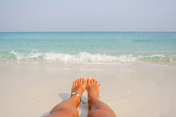 Woman's Bare Feet on the beach.
