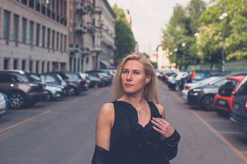 Beautiful girl posing in the city streets