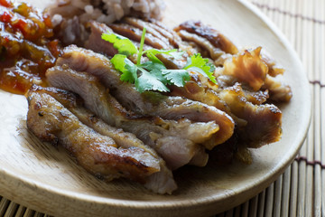 roasted pork on wooden plate