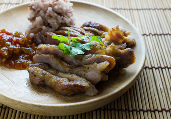 roasted pork on wooden plate