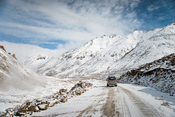 This road is snowy. It driving difficult. Mountains in Ladakh