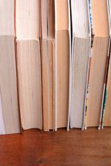 Old books leaning against each other for sale