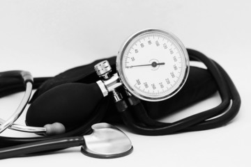 
Sphygmomanometer and stethoscope on a white background