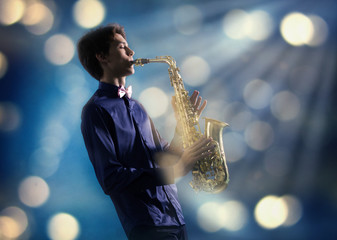A man plays the saxophone
