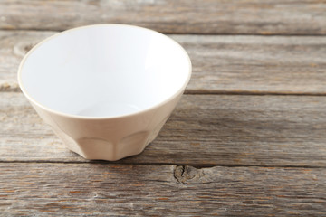 Empty bowl on grey wooden background