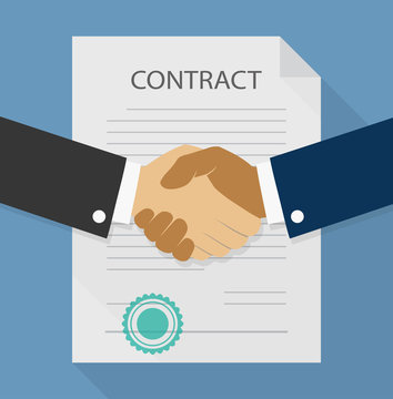Businessman handshake on contract paper after agreement