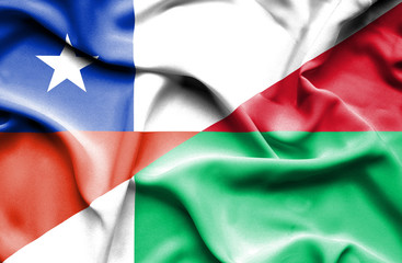Waving flag of Madagascar and Chile