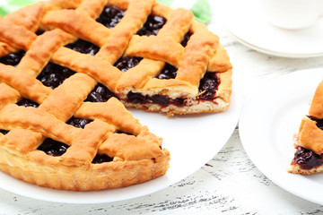 Homemade pie on white wooden background